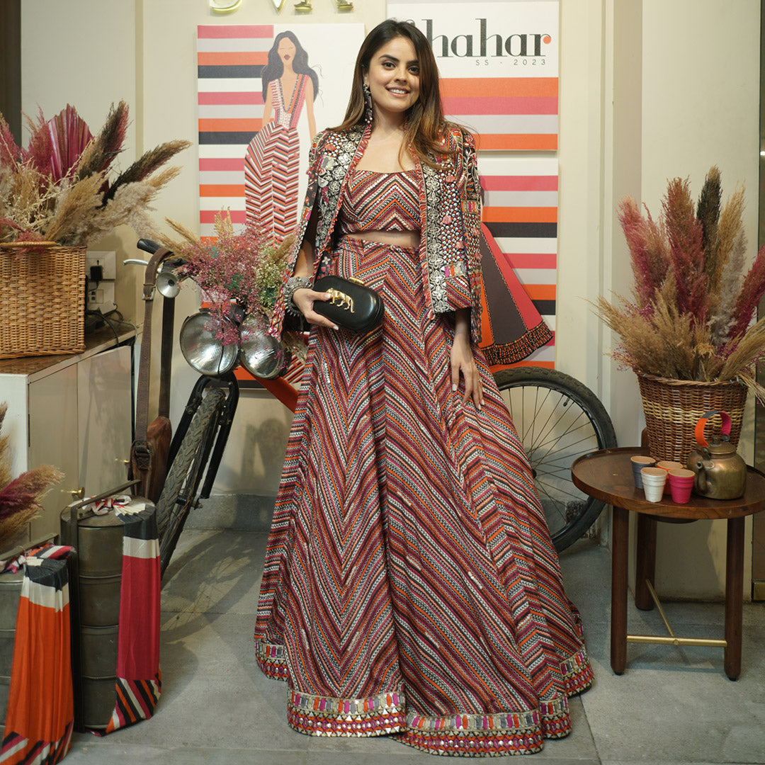 BOHEMIAN STRIPE PRINT LEHENGA TEAMED WITH BUSTIER AND PATCHWORK NOOR JACKET