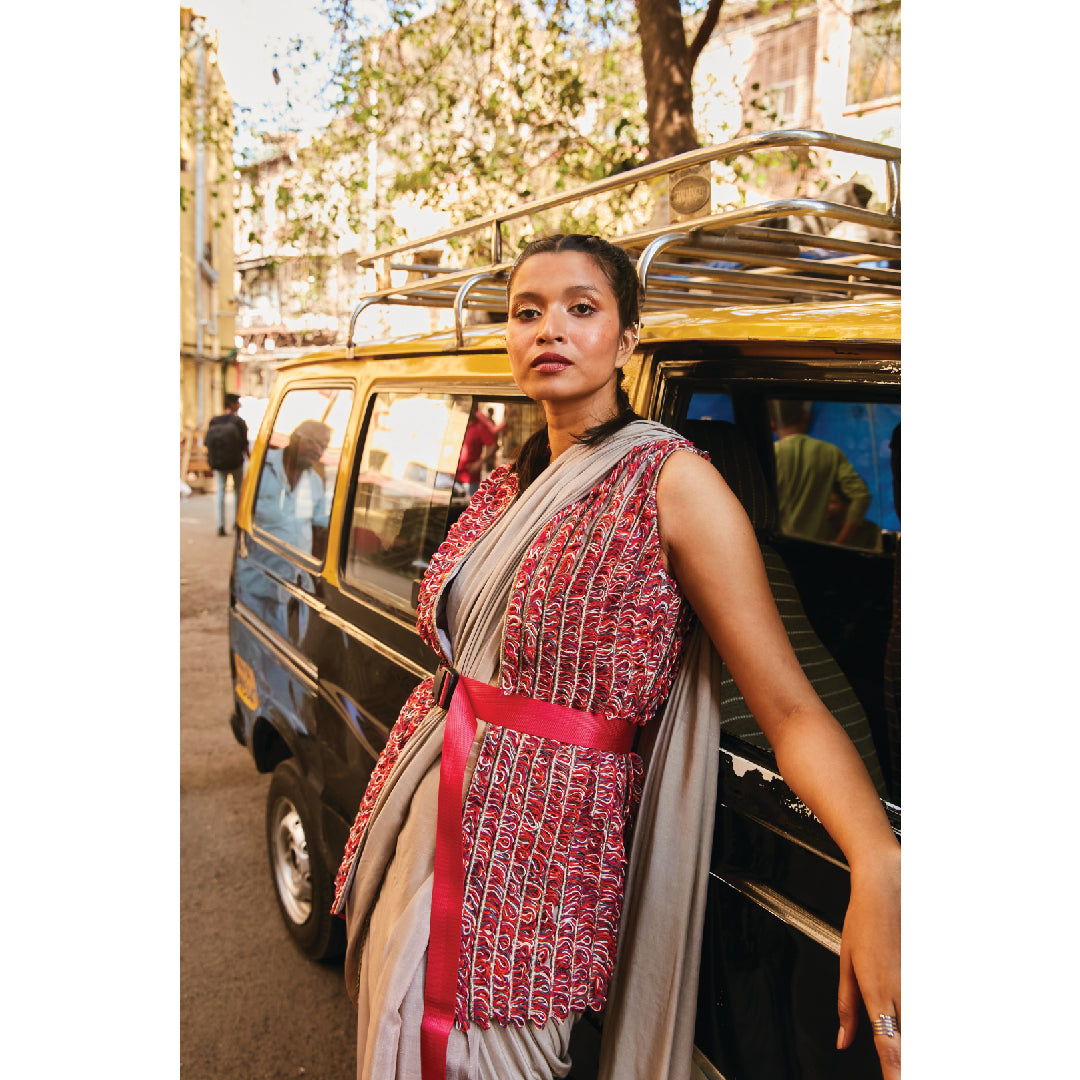 CONCRETE GREY PRE STITCHED CASCASE SAREE TEAMED WITH BUSTIER AND EMBELLISHED JACKET BELT: STYLING PURPOSE ONLY