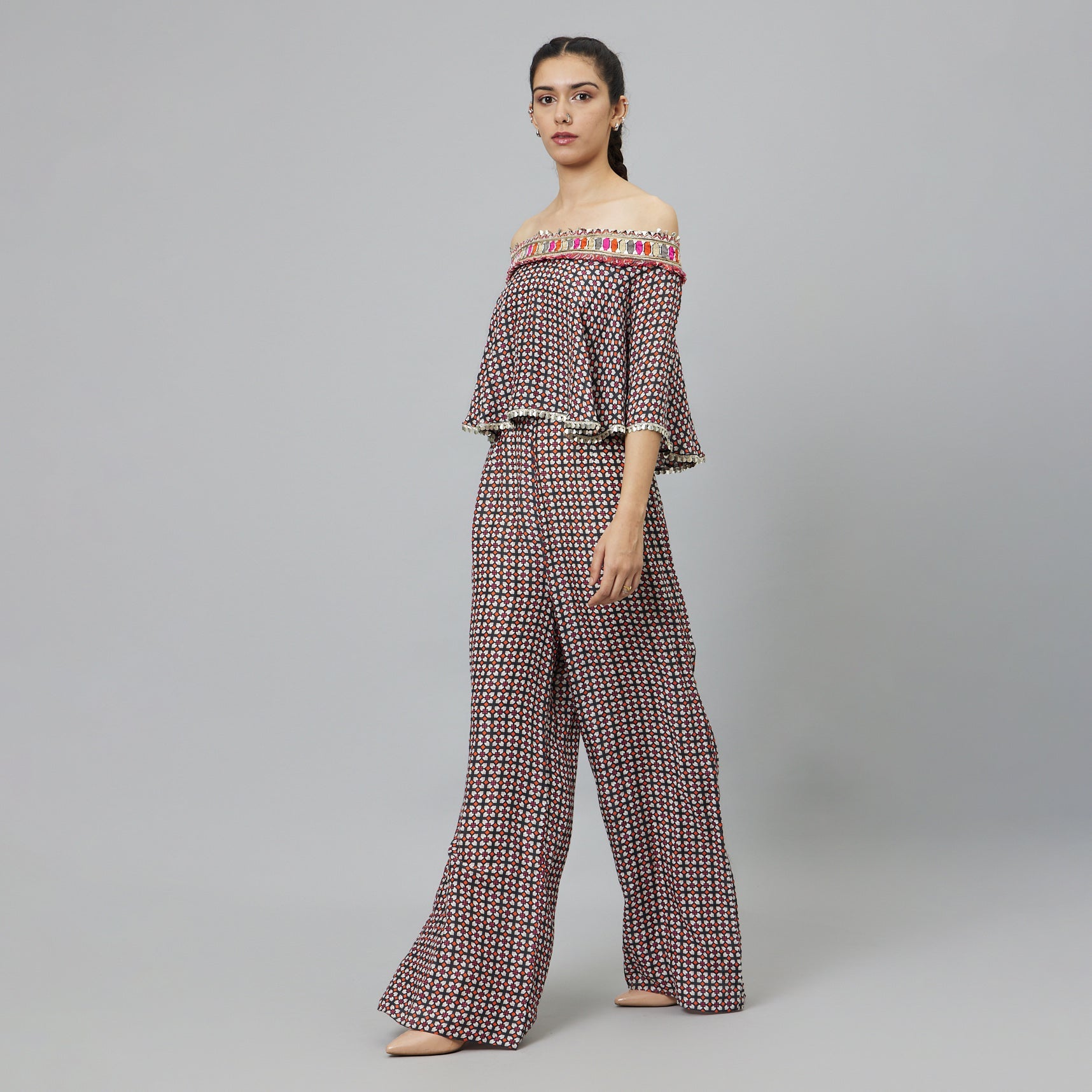 BLACK GEOMETRIC PRINT OFF-SHOULDER JUMPSUIT WITH ATTACHED CAPE