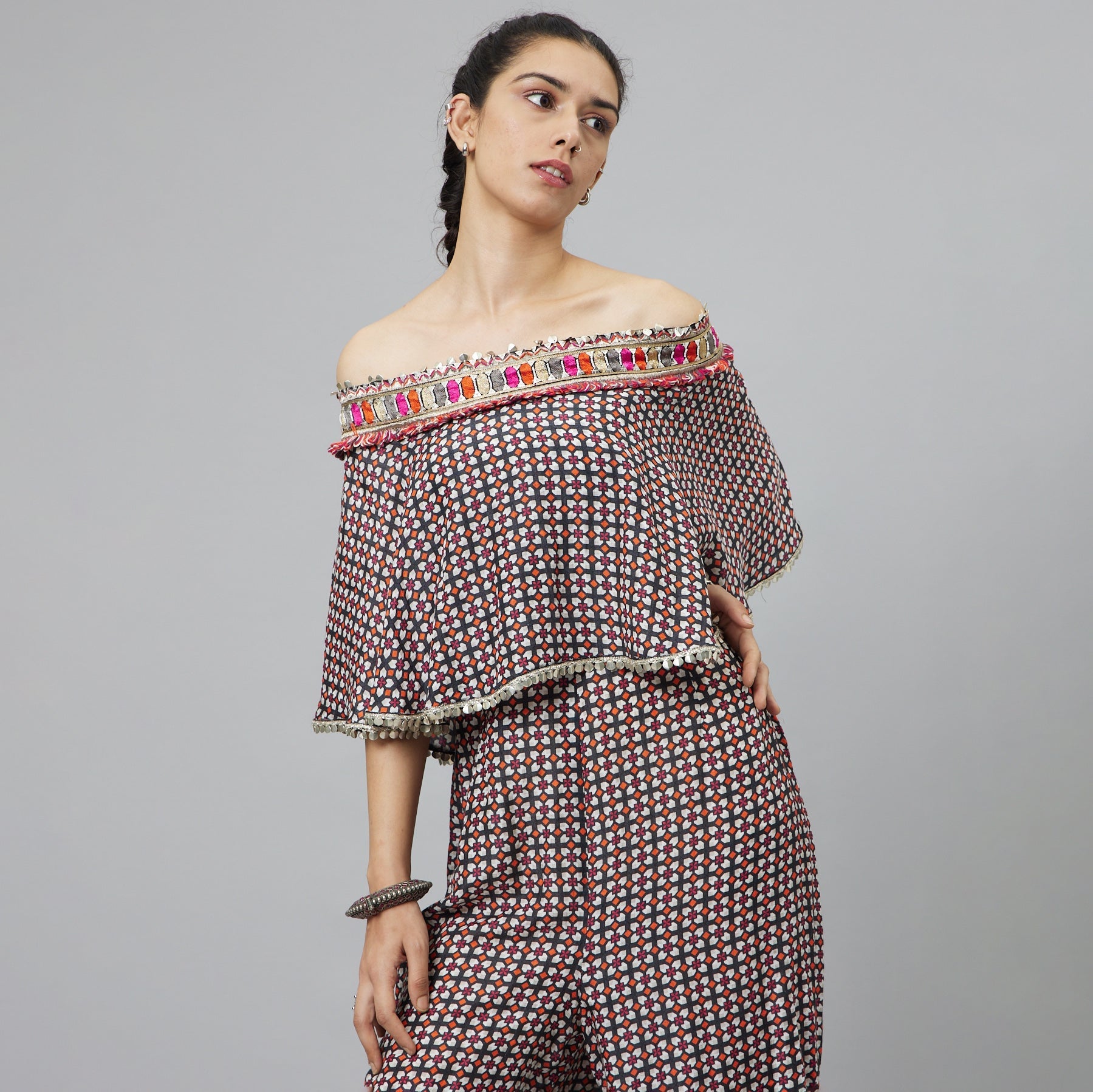 BLACK GEOMETRIC PRINT OFF-SHOULDER JUMPSUIT WITH ATTACHED CAPE