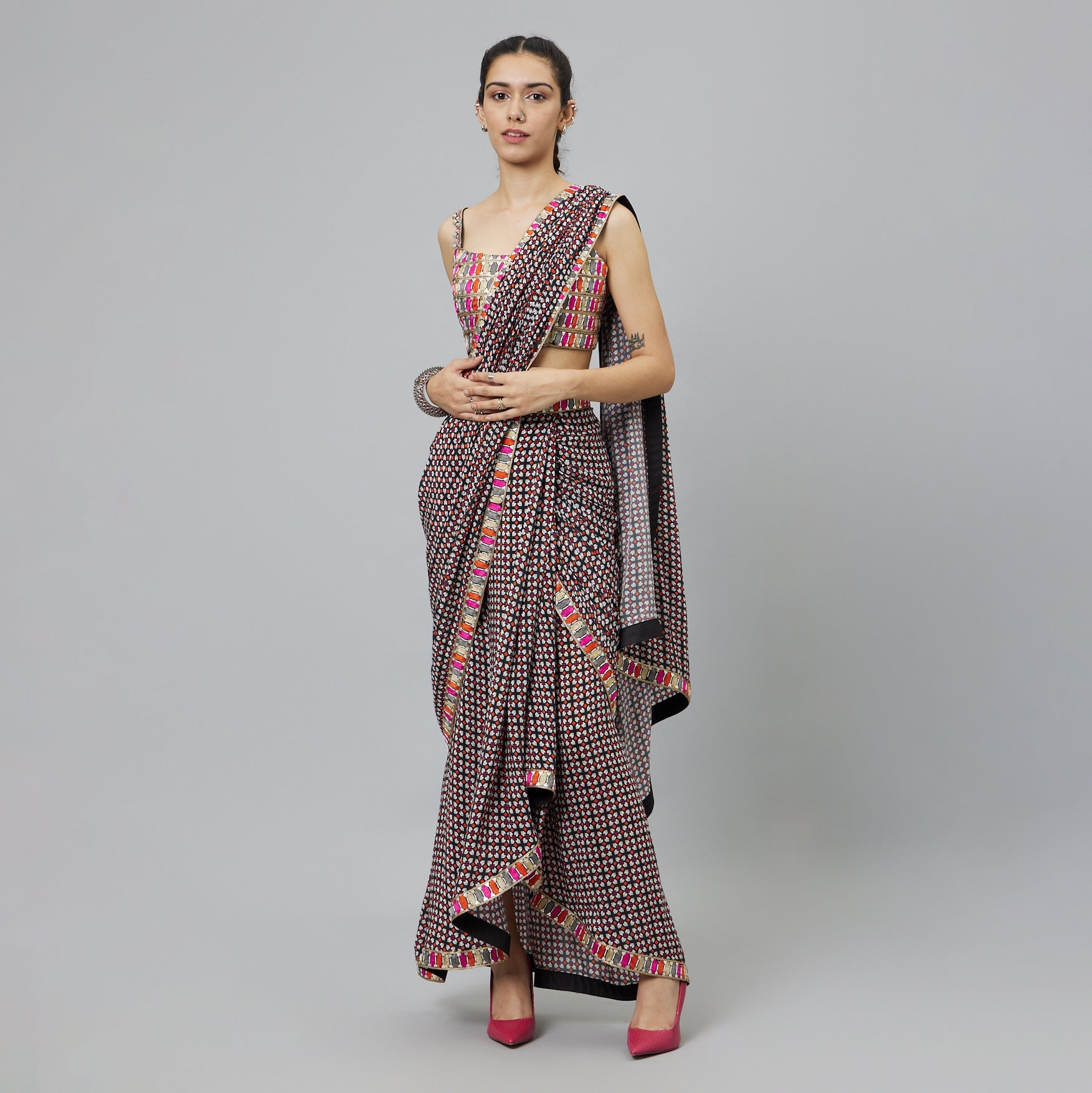 BLACK GEOMETRIC PRINT CASCASE SAREE TEAMED WITH EMBELLISHED BUSTIER