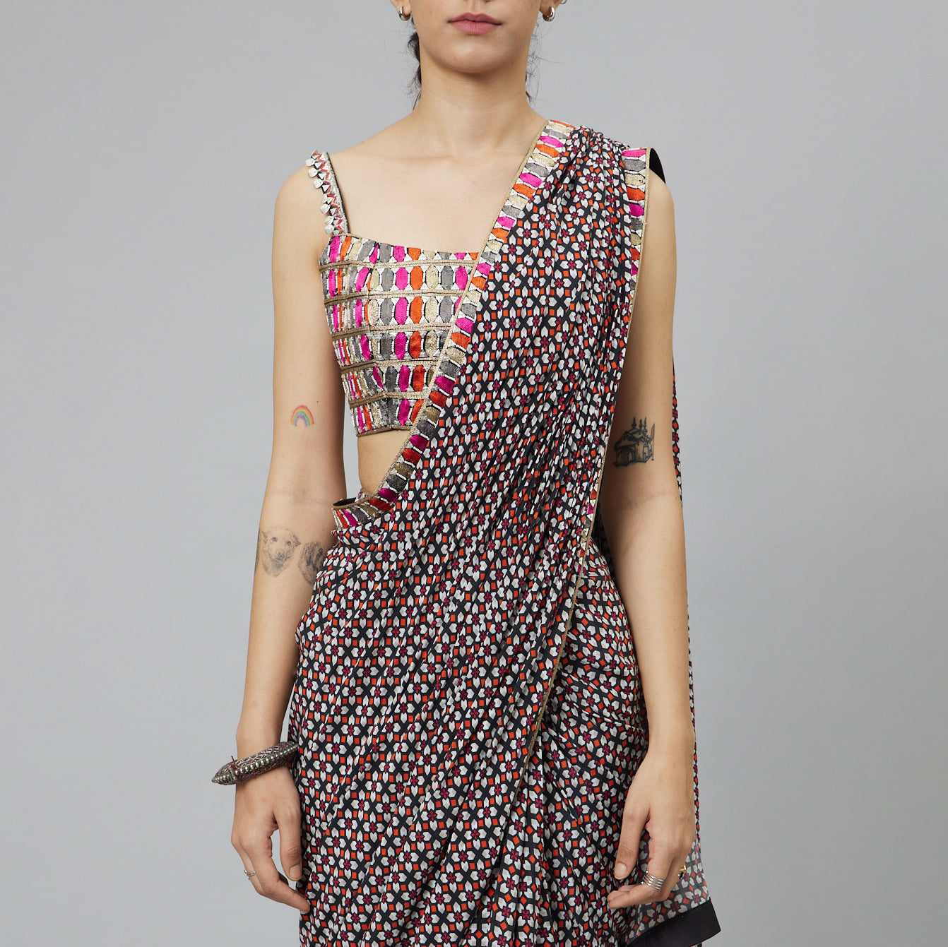 BLACK GEOMETRIC PRINT CASCASE SAREE TEAMED WITH EMBELLISHED BUSTIER