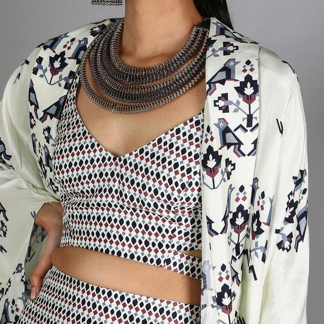 White Jaali Print Bustier And Drape Skirt Paired With White Half Bird Print And Half Geometric Damask Print Cape