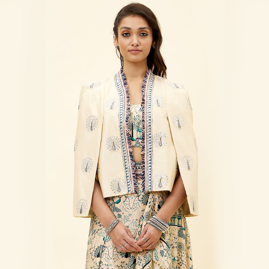 BEIGE MOR JAAL PRINT  NUSRAT DRAPED SKIRT AND BUSTIER TEAMED WITH A SIGNATURE  STRUCTURED CAPE JACKET