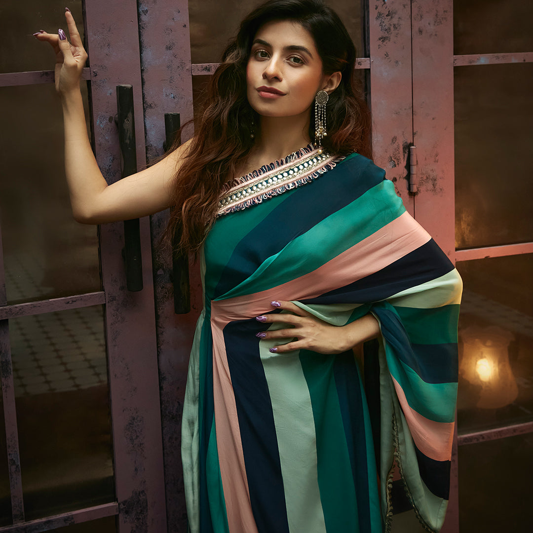 STRIPES PRINT ONE SHOULDER DRAPED SAREE TEAMED WITH PANTS