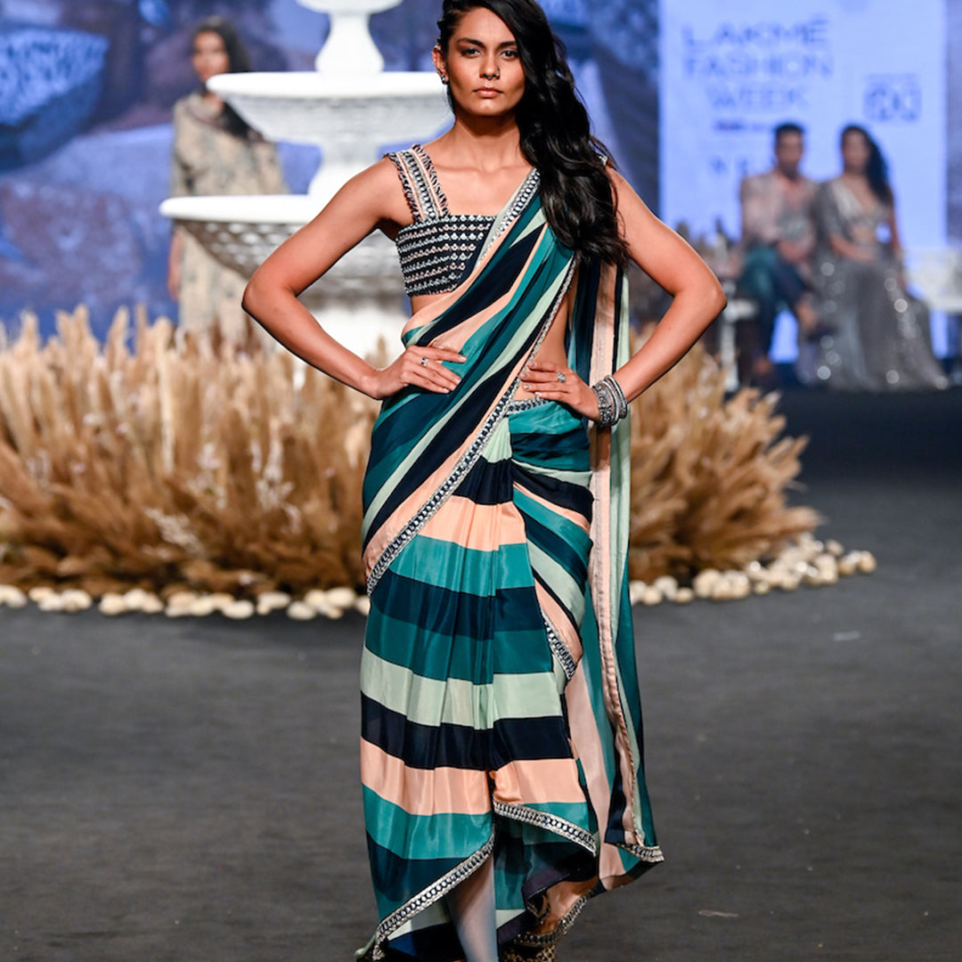 STRIPE PRINT PRE STITCHED CASCASE SAREE TEAMED WITH AN EMBELLISHED BANDEAU BLOUSE