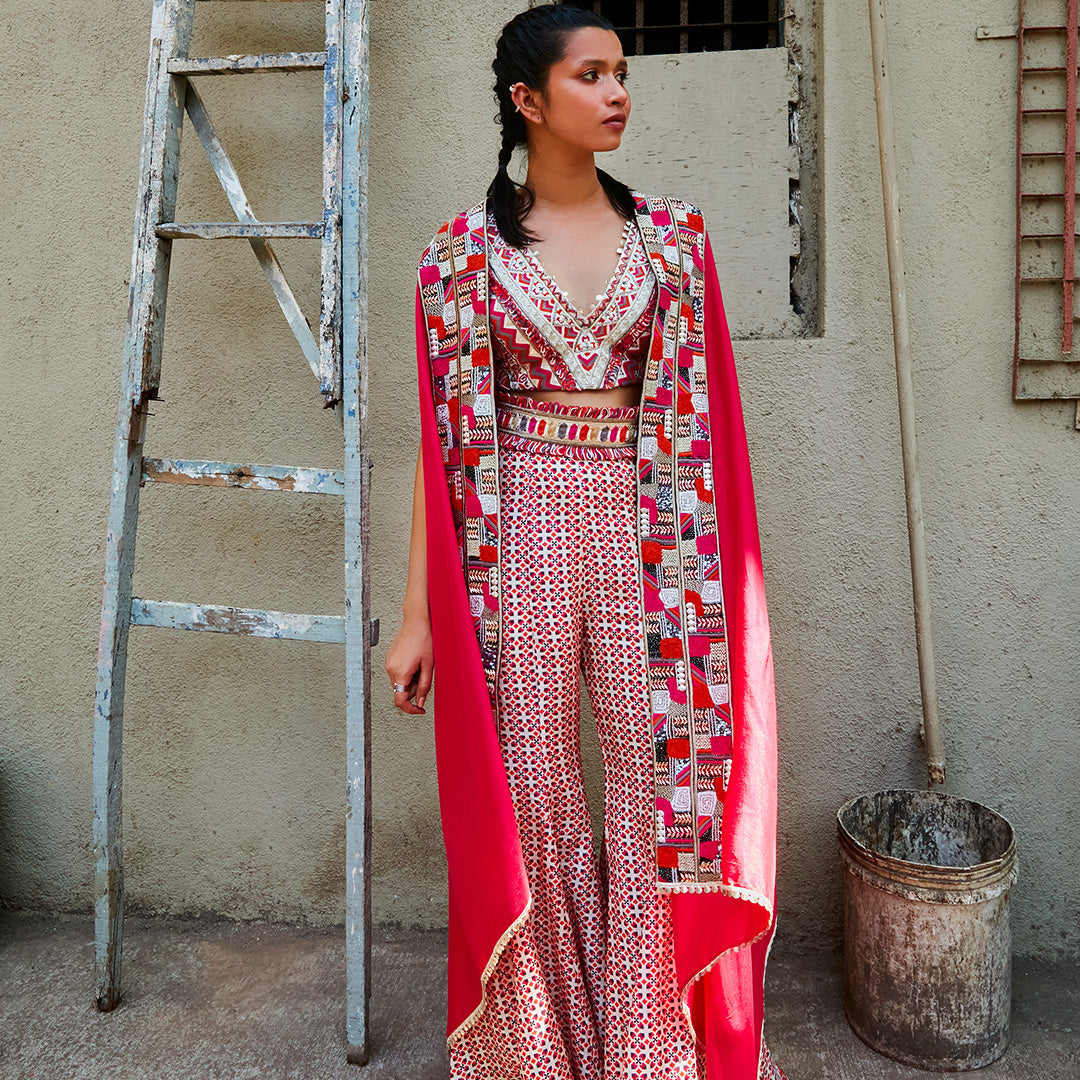 TEXTURED CROP TOP TEAMED WITH IVORY GEOMETRIC PRINT BOX PLEAT PANTS WITH EMBELLISHED CAPE