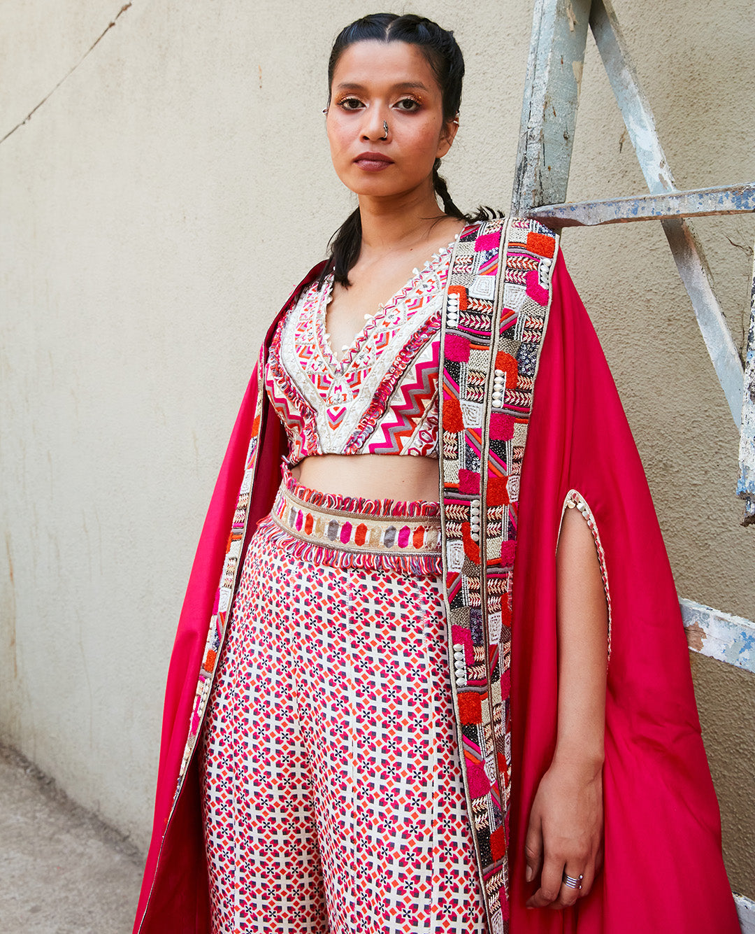 TEXTURED CROP TOP TEAMED WITH IVORY GEOMETRIC PRINT BOX PLEAT PANTS WITH EMBELLISHED CAPE