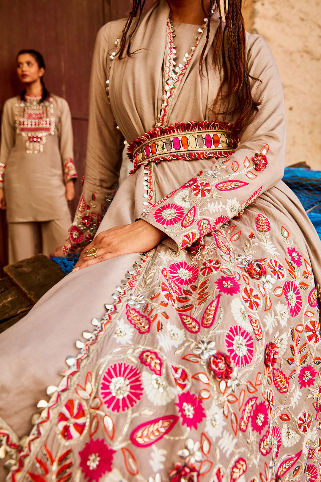 CONCRETE GREY LEHENGA TEAMED WITH A BLOUSE AND ATTACHED DRAPE WITH FLORAL EMBELLISHMENT