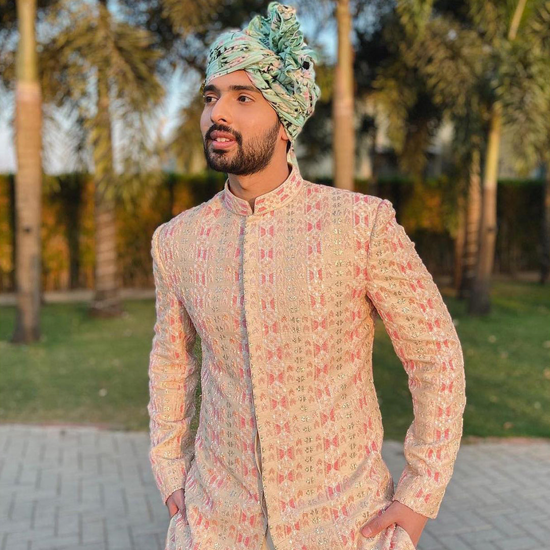 BEIGE EMBELLISHED SHERWANI PAIRED WITH PINK PANTS