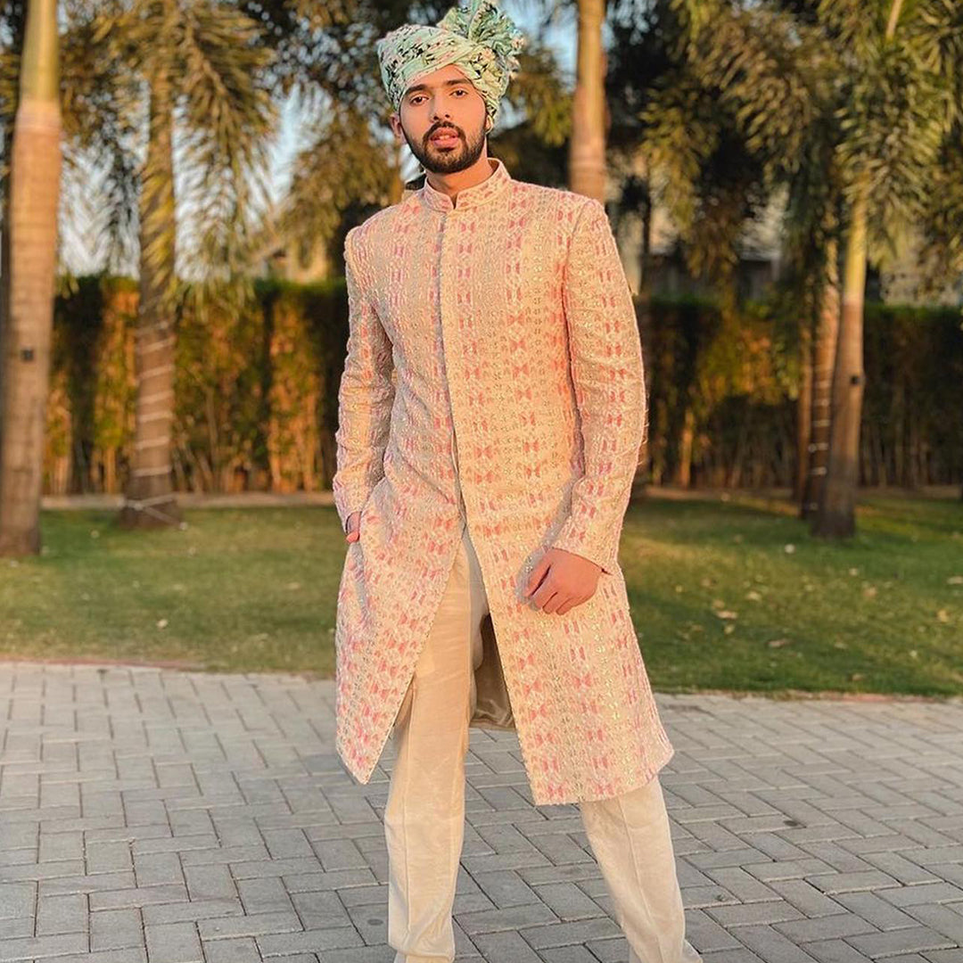 BEIGE EMBELLISHED SHERWANI PAIRED WITH PINK PANTS