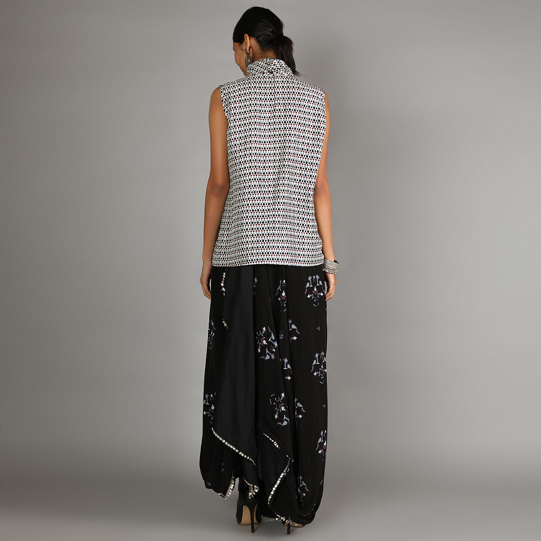 Jaali Print White Turtle Neck Top Paired With Black Bird Print Drape Skirt With Cape